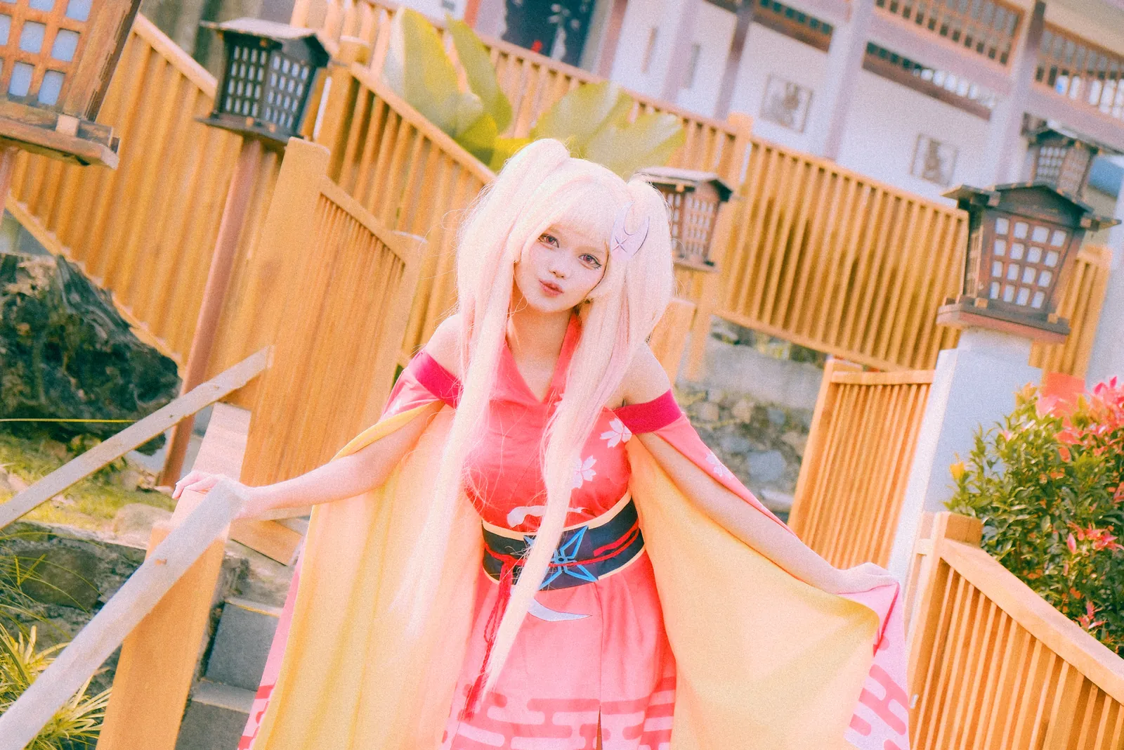 Kaguya cosplay posing on warm wooden steps