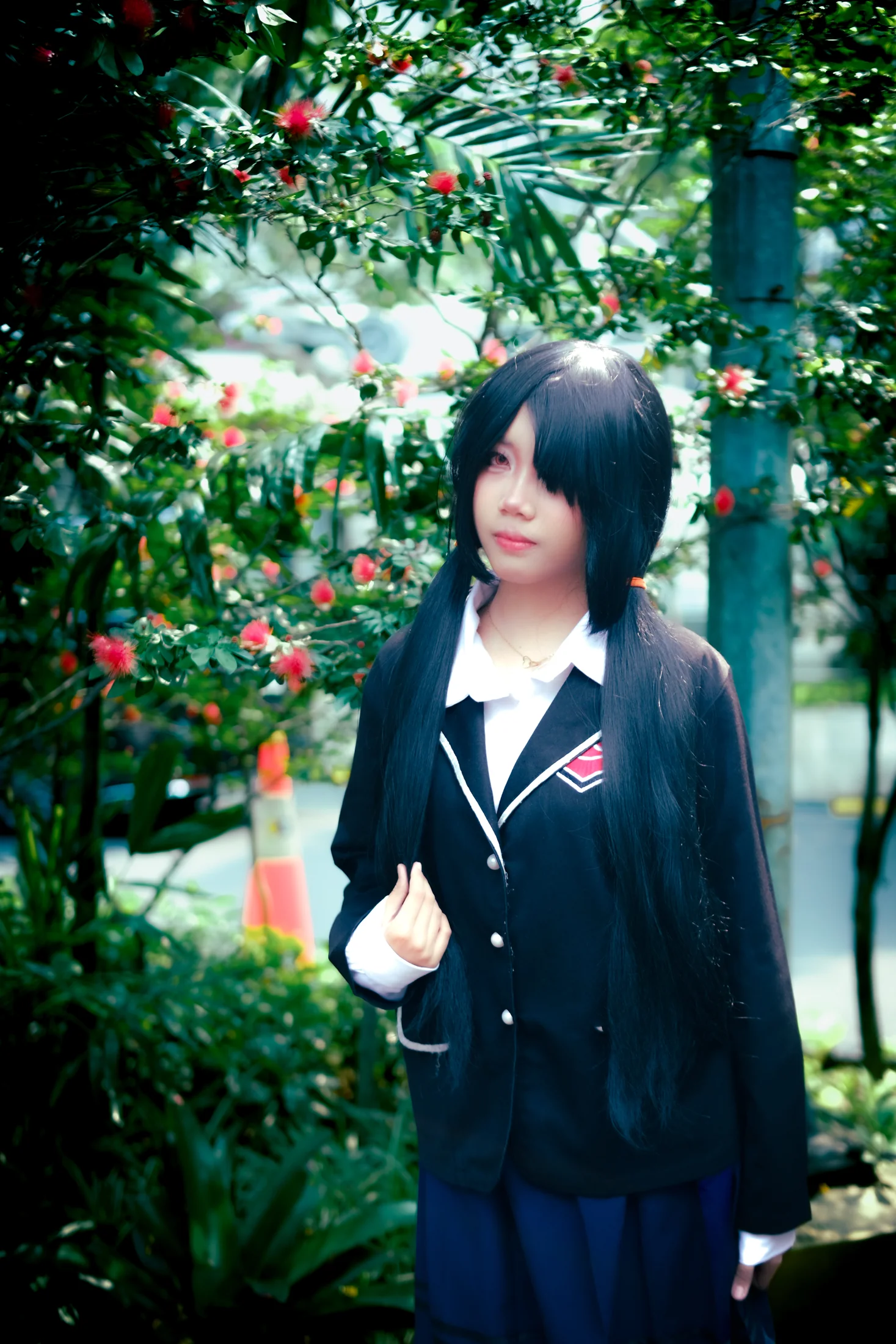 Kurumi cosplay portrait among flowering plants