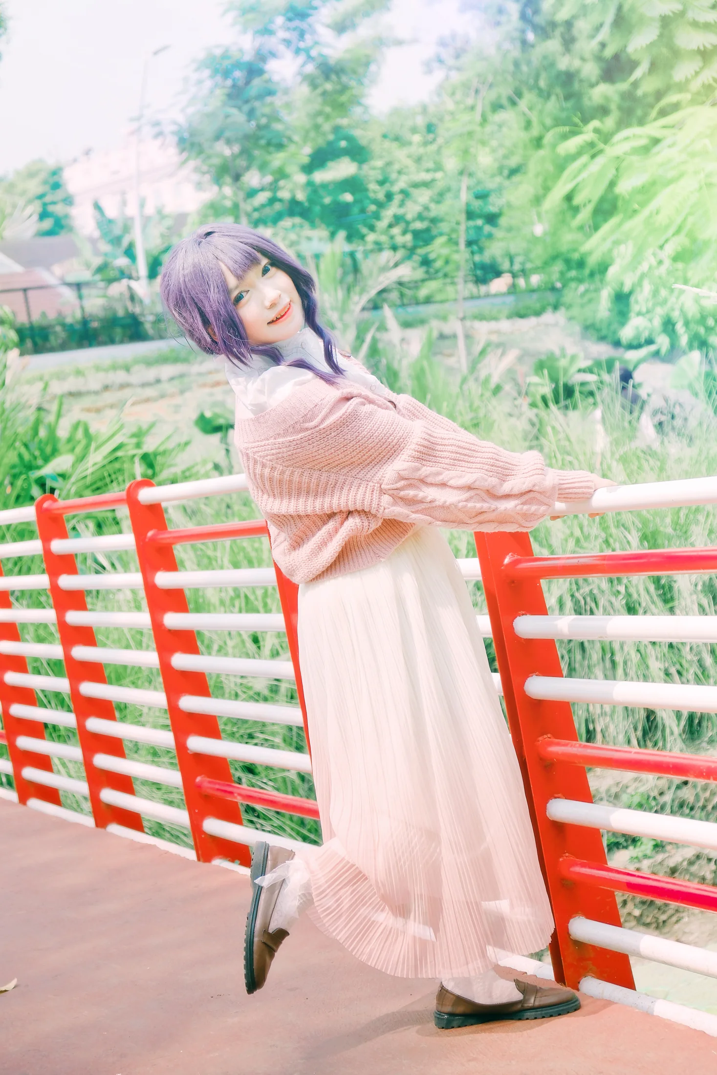 Waguri Magazine number 2 portrait beside a red railing