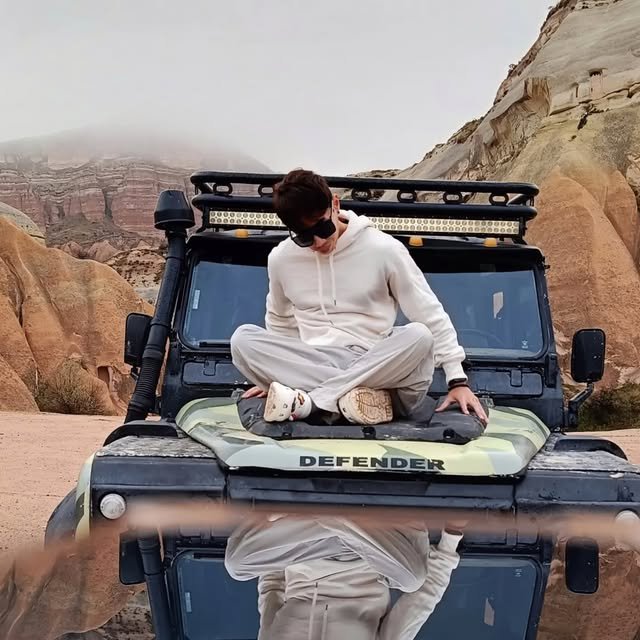 Nino sitting on an off-road vehicle